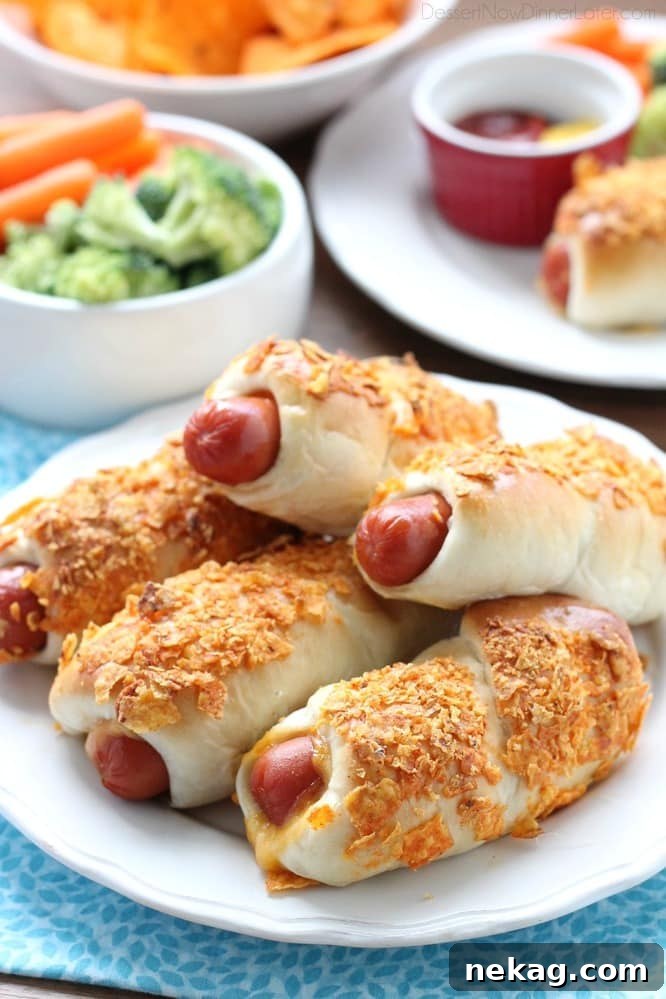 Frozen dough, nacho tortilla chips, and extra cheese transform ordinary pigs in a blanket into these extraordinary crunchy nacho dogs.