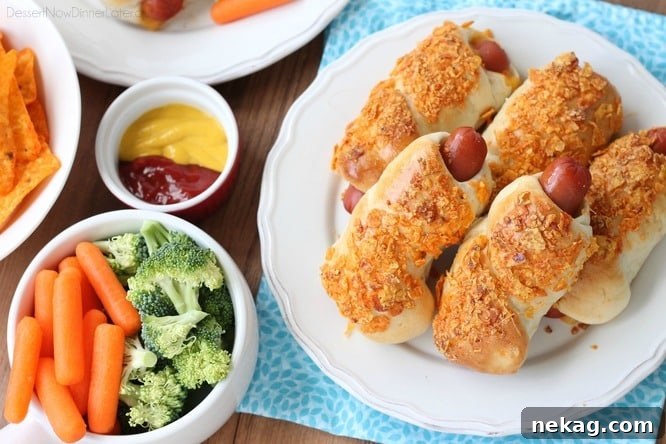 Frozen dough, nacho tortilla chips, and extra cheese transform ordinary pigs in a blanket into these extraordinary crunchy nacho dogs.