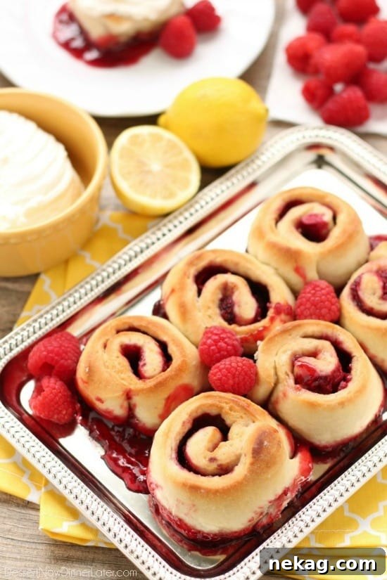 Sticky Raspberry Lemon Rolls are made easy with frozen dough and are topped with a sweet and citrusy lemon cream cheese frosting.