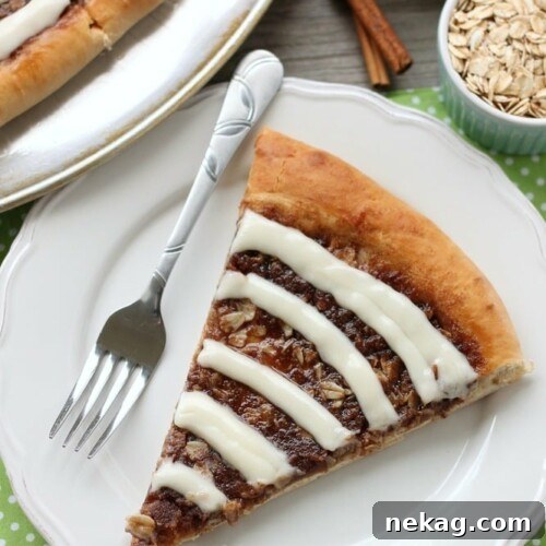 This Cinnamon Roll Dessert Pizza is an amazing copycat version of Papa Murphy's Cinnamon Wheel, with brown sugar, cinnamon, and oats, topped with a tangy cream cheese icing.