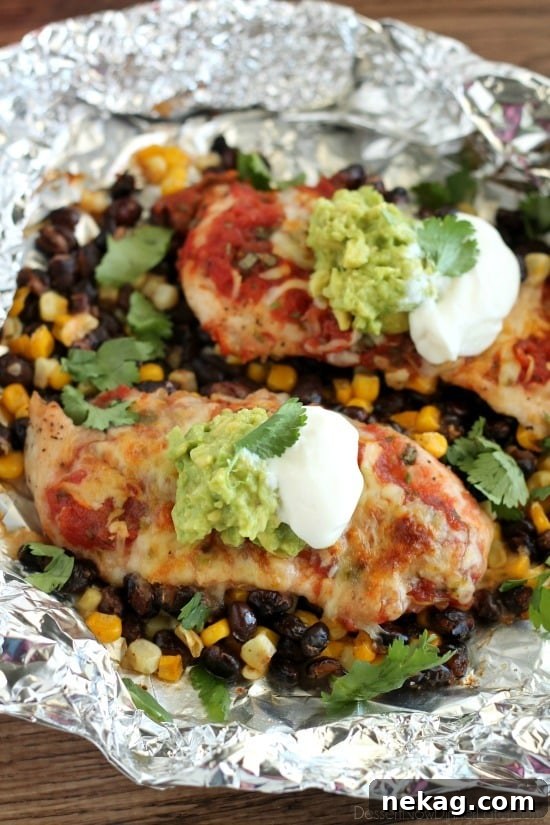 These Southwestern Chicken Packets are an easy and delicious tin-foil dinner recipe you can cook with a fire (while camping), on a grill, or in an oven.
