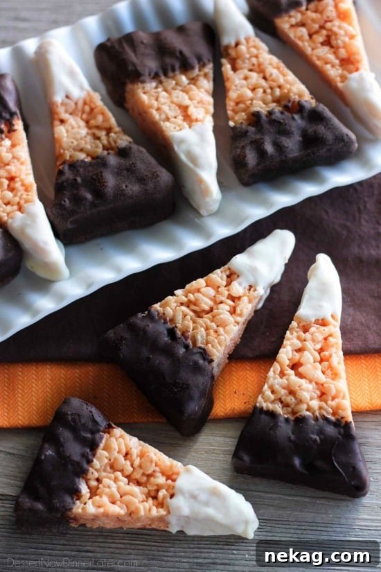 Chocolate-Dipped Candy Corn Rice Krispie Treats Recipes 2 Chocolate Dipped Candy Corn Rice Krispie Treats are a fun and easy Halloween treat that the whole family will enjoy!