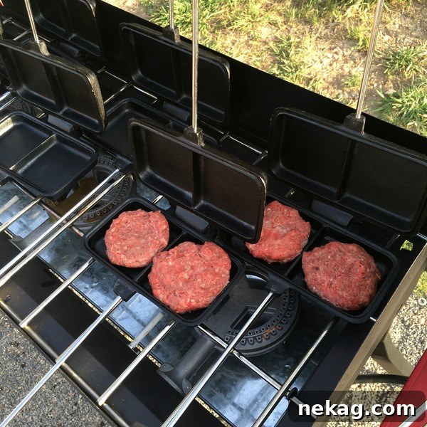 Grilling burgers in dual Camp Chef pie irons.