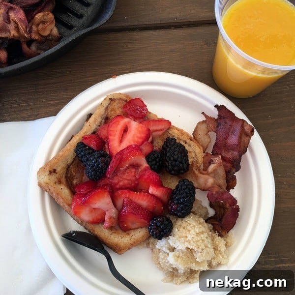 French Toast with fruit, brown sugar grits, and bacon.