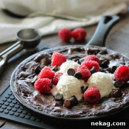 Skillet Brownie Recipe: Gooey Chocolate Brownie for Sharing 8 This fudgy skillet brownie is made with a boxed mix for a quick dessert for two! Eat it warm from the oven topped with ice cream, chocolate chips, and fresh raspberries for an extra special treat!