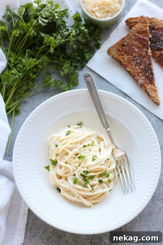 This Garlic Parmesan Spaghetti has browned butter and garlic in its thick and creamy parmesan sauce, for a super flavorful pasta dinner that will have you licking the plate clean.