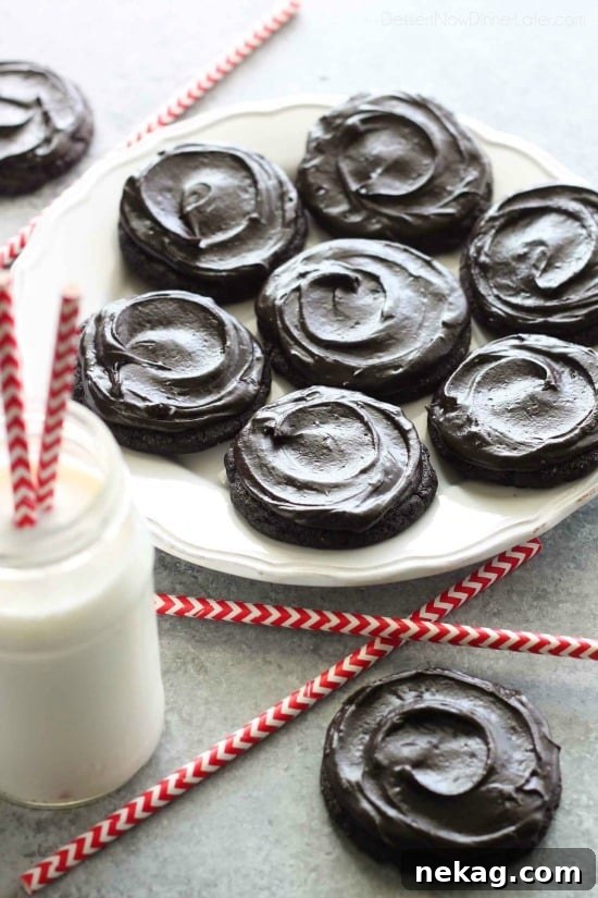 Fudgy dark chocolate sugar cookies are frosted with a creamy chocolate buttercream frosting. Inspired by Swig's Dirtball Cookie, these frosted chocolate sugar cookies are sure to be a new favorite!