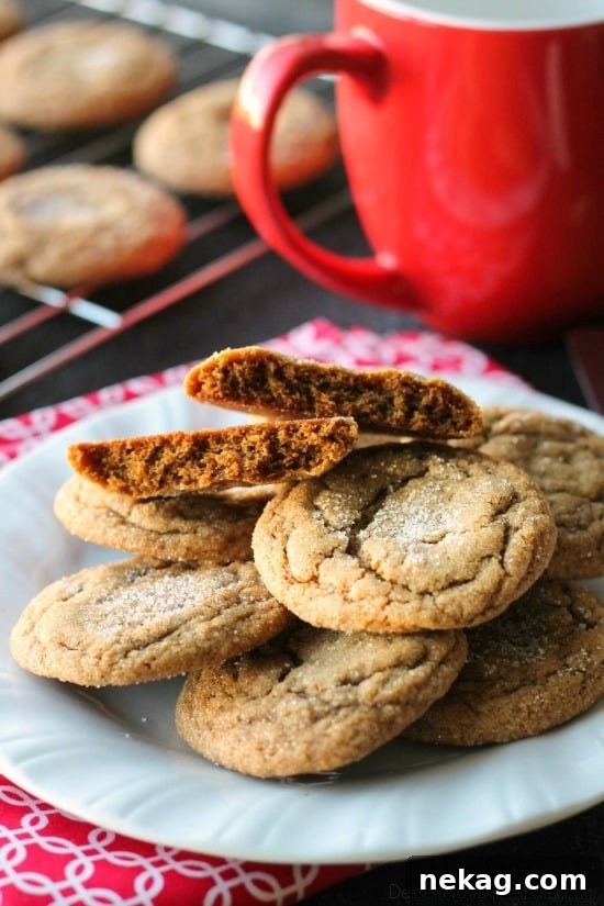These Soft Baked Gingersnap Cookies are thick and chewy, and full of rich molasses, ginger, and spices for a wonderful Christmas cookie everyone will love!