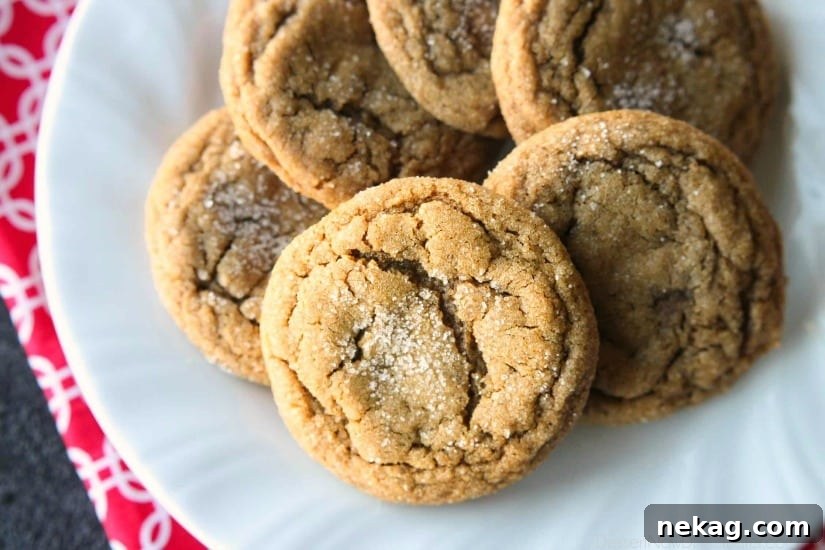 These Soft Baked Gingersnap Cookies are thick and chewy, and full of rich molasses, ginger, and spices for a wonderful Christmas cookie everyone will love!