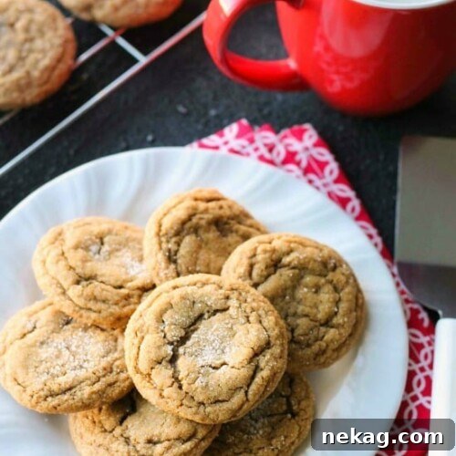These Soft Baked Gingersnap Cookies are thick and chewy, and full of rich molasses, ginger, and spices for a wonderful Christmas cookie everyone will love!