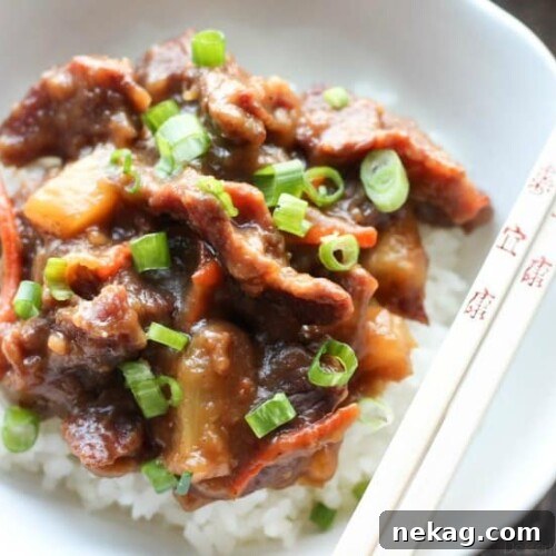 This Slow Cooker Mongolian Beef & Pineapple is a little spicy, a little sweet, full of authentic Asian flavors, and is so easy to make!