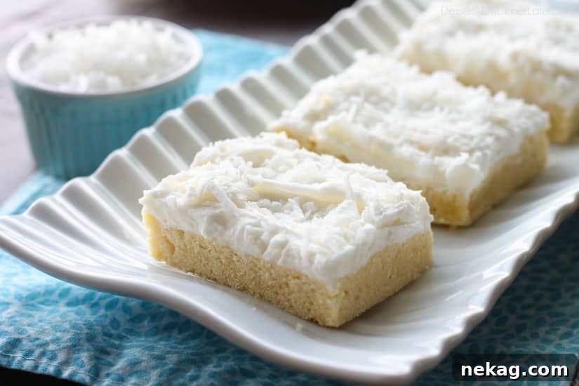 Chewy Coconut Sugar Cookie Bars Recipe 4 These Coconut Sugar Cookie Bars have lots of delicious coconut flavor from the crust, to the frosting, and the shredded coconut on top. Plus, they are super soft, chewy, and easy to make!