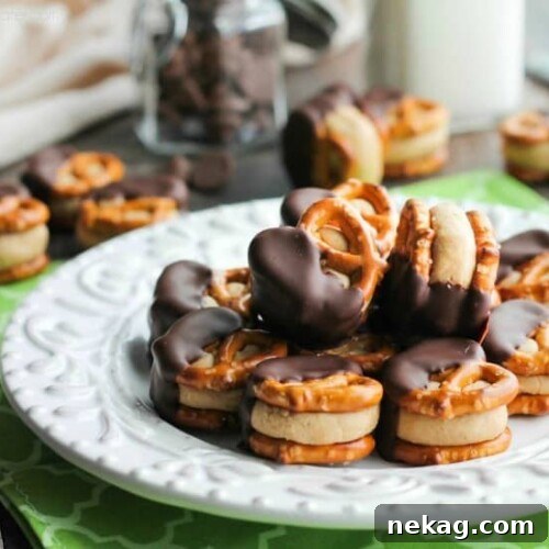 Peanut Butter Balls are made into pretzel bites for a salty-sweet addicting treat! Perfect for parties or Christmas neighbor gifts!