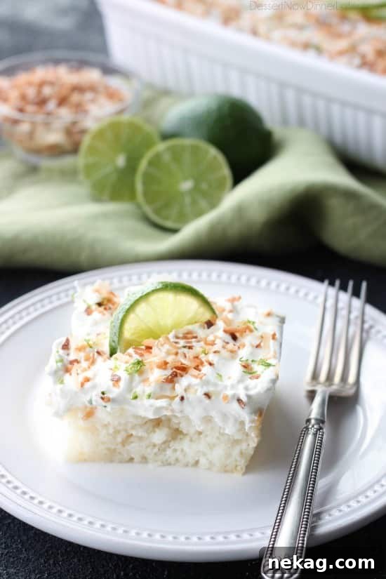 Coconut Lime Poke Cake - a fluffy, white, lime-infused cake soaked with coconut cream, topped with whipped cream, toasted coconut, and lime zest.