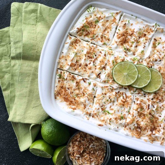 Coconut Lime Poke Cake on a serving plate.