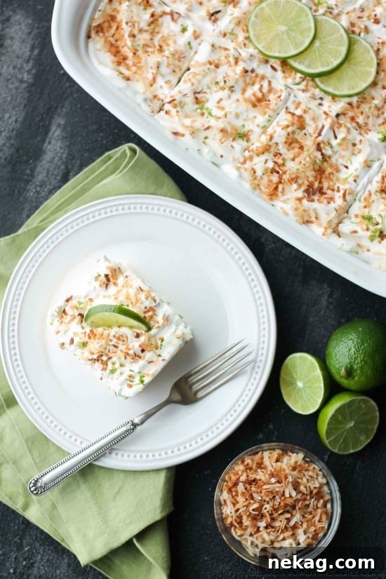 Coconut Lime Poke Cake served with lime garnish.