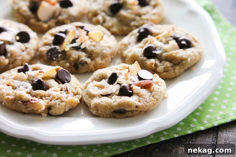 Almond Coconut Chocolate Chip Cookie Recipe for Chewy Treats 6 Almond Coconut Chocolate Chip Cookies are loaded with sliced almonds, shredded coconut, chocolate chips and flavored extracts for an Almond Joy inspired twist on the traditional chocolate chip cookie.