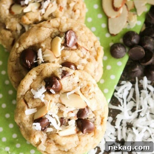 Almond Coconut Chocolate Chip Cookie Recipe for Chewy Treats 7 Almond Coconut Chocolate Chip Cookies are loaded with sliced almonds, shredded coconut, chocolate chips and flavored extracts for an Almond Joy inspired twist on the traditional chocolate chip cookie.
