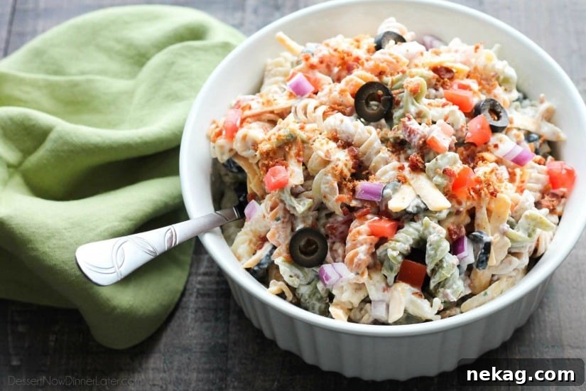 Bacon Ranch Pasta Salad is perfect for BBQ's and all your summer get togethers. It's loaded with pasta, bacon, cheese, olives, tomatoes, and onion - then tossed with a simple, creamy ranch dressing. 