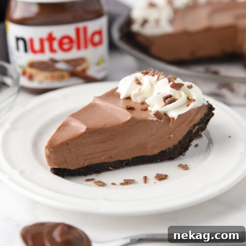Slice of no bake Nutella cheesecake on a plate.