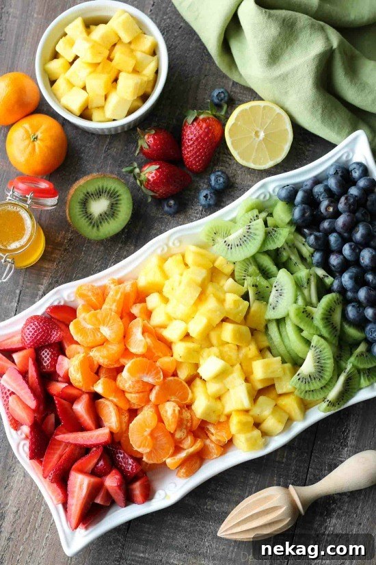 This summer fruit salad is as colorful as a rainbow, and is tossed in a reduced honey orange glaze for the perfect amount of added sweetness and flavor. Great for barbecues, potlucks, and picnics!