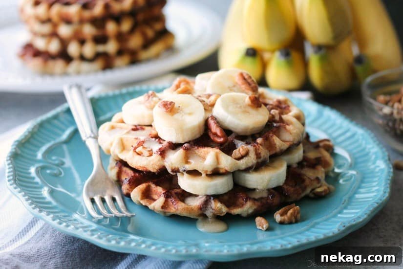 Banana Nut Cinnamon Roll Waffles Recipe — Fluffy, Caramelized Treat 4 Cinnamon Roll Waffles are topped with freshly sliced bananas, crunchy nuts, and a maple cream cheese drizzle.