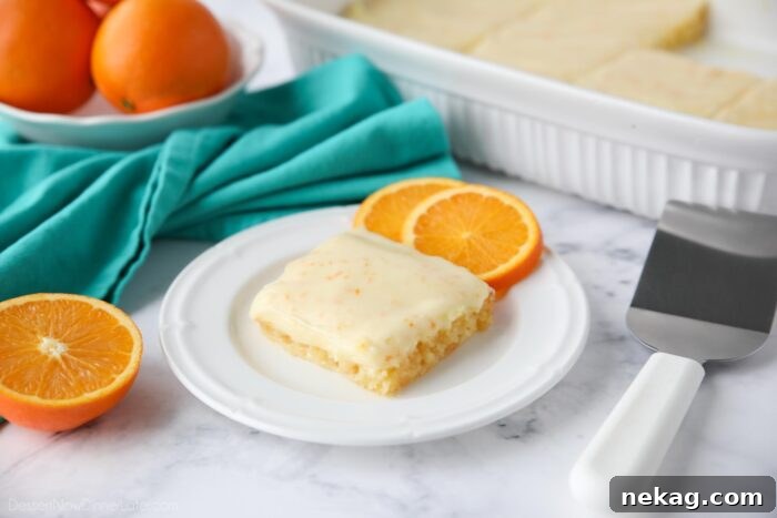 Orange blondies with frosting.