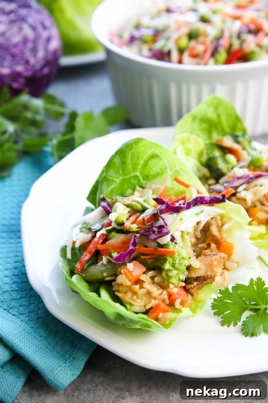 Whip up these Teriyaki Chicken Lettuce Wraps with Asian Slaw in no time for an easy family dinner with insanely tasty flavors!