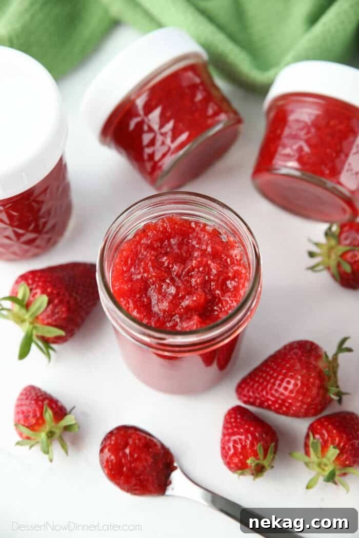 Low-Sugar Strawberry Freezer Jam Recipe with Video Tutorial 6 An open jar of thick strawberry freezer jam.