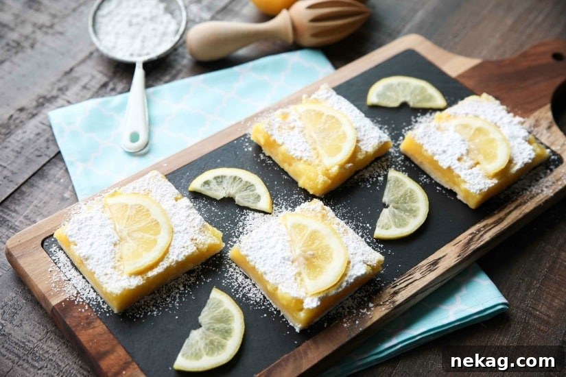 Zesty Lemon Bars Recipe: Tangy Shortbread Squares 5 Slices of lemon bars on a board with powdered sugar and lemon slices on top.