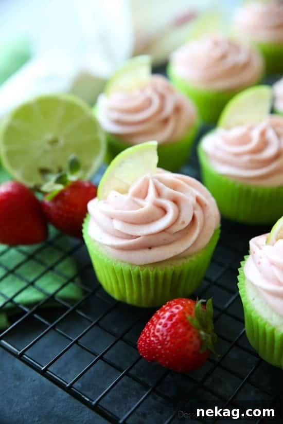 Strawberry Lime Cupcakes are perfect for summer, with a tangy lime cupcake base and sweet strawberry frosting they are sure to be loved by all. A family-friendly, non-alcoholic alternative to strawberry margarita cupcakes!