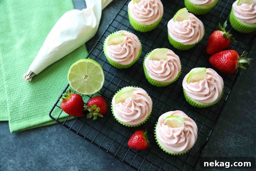 Strawberry Lime Cupcakes are perfect for summer, with a tangy lime cupcake base and sweet strawberry frosting they are sure to be loved by all. A family-friendly, non-alcoholic alternative to strawberry margarita cupcakes!