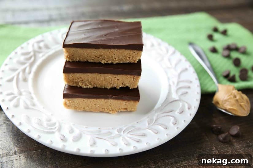 Easy No Bake Peanut Butter Bars taste a lot like a Reese's Peanut Butter Cup. The perfect party pleasing dessert with a sweet peanut butter base, and creamy chocolate ganache topping.