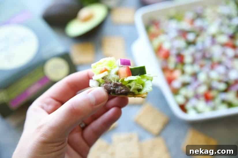 Lightened Seven-Layer Dip Recipe for Parties and Game Day 6 This Skinny Seven Layer Dip is loaded with fresh veggies, and makes a great appetizer or snack for any party or barbecue!