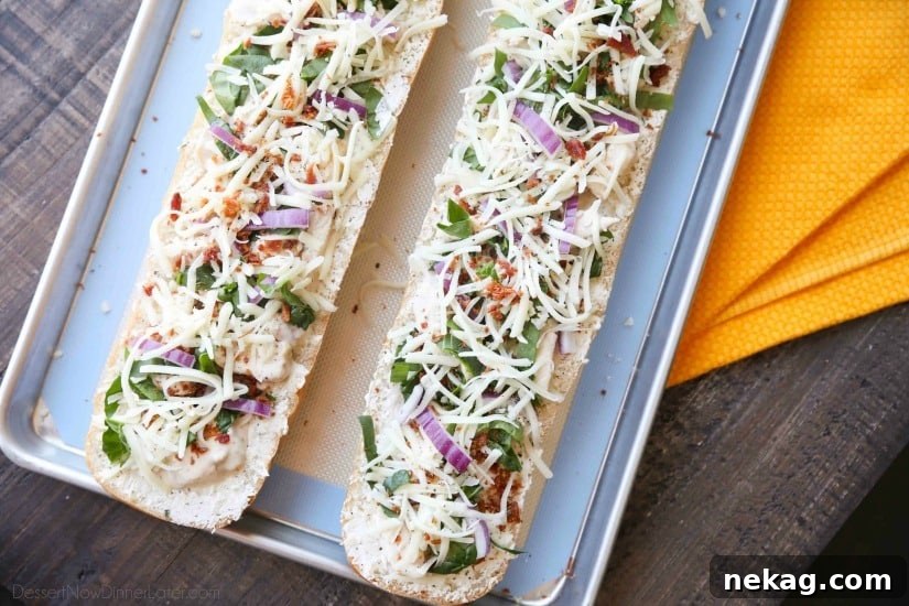 Chicken Alfredo Garlic Bread Pizza is a quick and easy dinner with loads of flavor! Pick up a loaf of French bread and make this tonight!