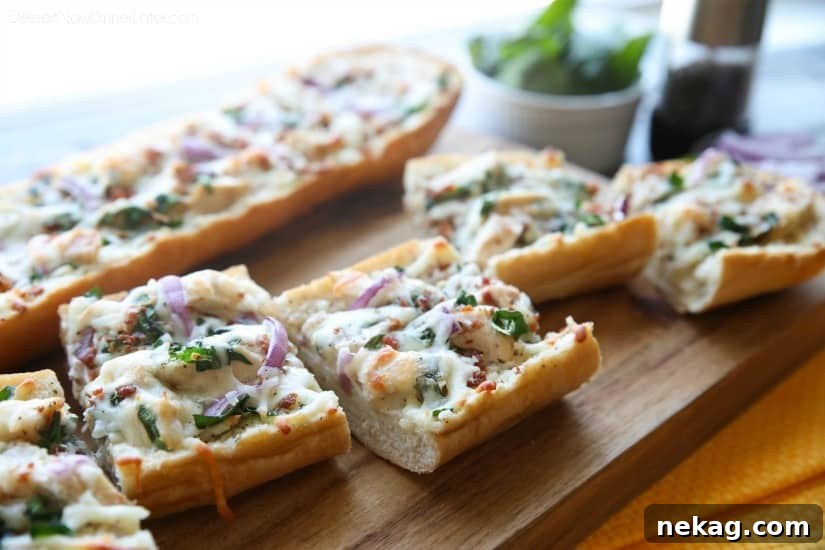 Chicken Alfredo Garlic Bread Pizza is a quick and easy dinner with loads of flavor! Pick up a loaf of French bread and make this tonight!