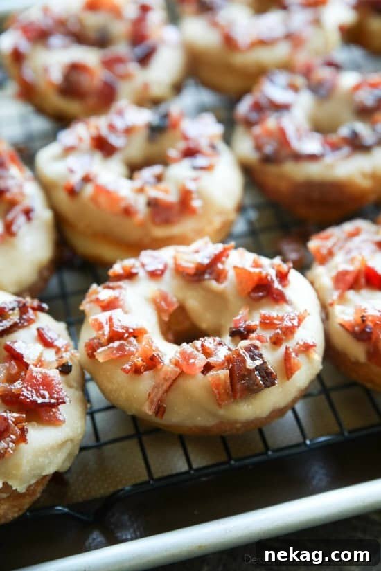 Maple-Bacon Donuts: Sweet Maple Glaze with Crispy Bacon 4 Maple Bacon Donuts are breakfast perfection! The salty bacon cuts through the sweetness of the maple and brown sugar glaze on top of a fluffy yeast donut.