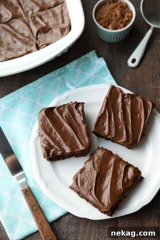 Stack of frosted fudge brownies