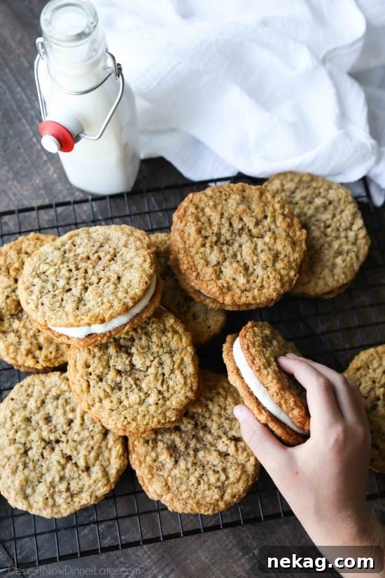 Oatmeal Cream Pies - Soft and chewy oatmeal cookies filled with vanilla buttercream frosting.