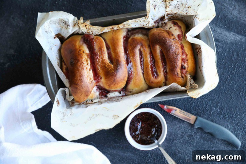 Halloween Intestines Bread Recipe — Creepy Savory Loaf Tutorial 3 Intestines Bread is a fun halloween party food that makes you look twice. All it really is, is a sweet pull apart bread with cream cheese and raspberries.