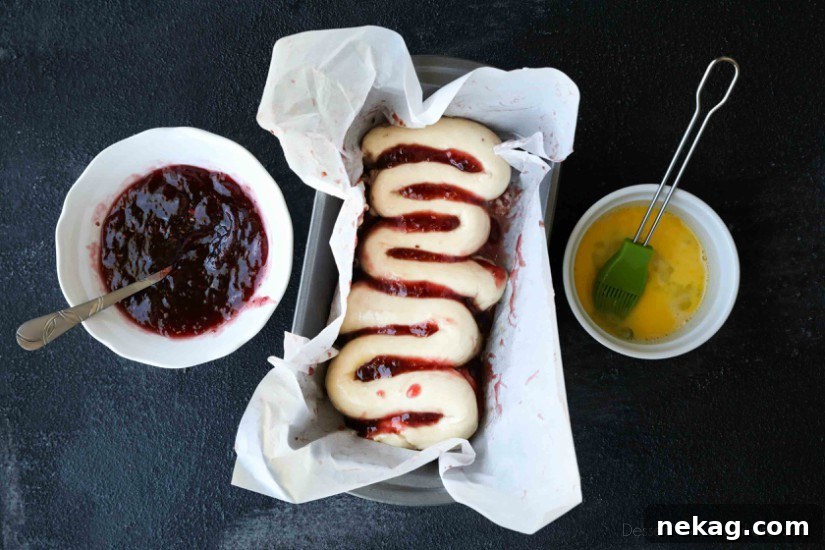 Halloween Intestines Bread Recipe — Creepy Savory Loaf Tutorial 6 Intestines Bread is a fun halloween party food that makes you look twice. All it really is, is a sweet pull apart bread with cream cheese and raspberries.
