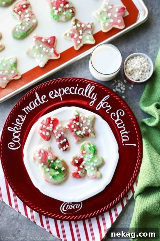 Swirled Christmas Sugar Cookies make cookie decorating easy! Simply swirl food coloring in a special glaze and dip the cookie!
