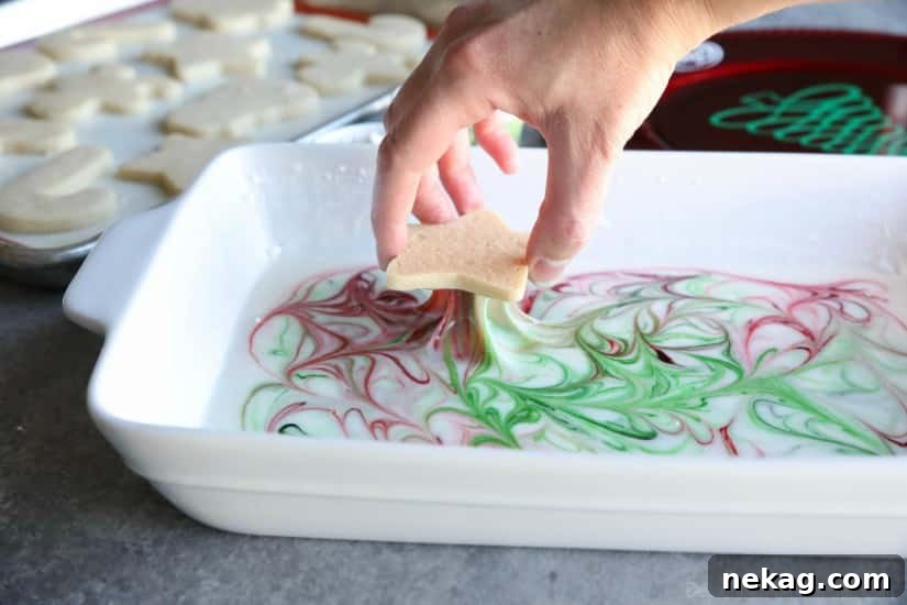 Swirled Christmas Sugar Cookies make cookie decorating easy! Simply swirl food coloring in a special glaze and dip the cookie!