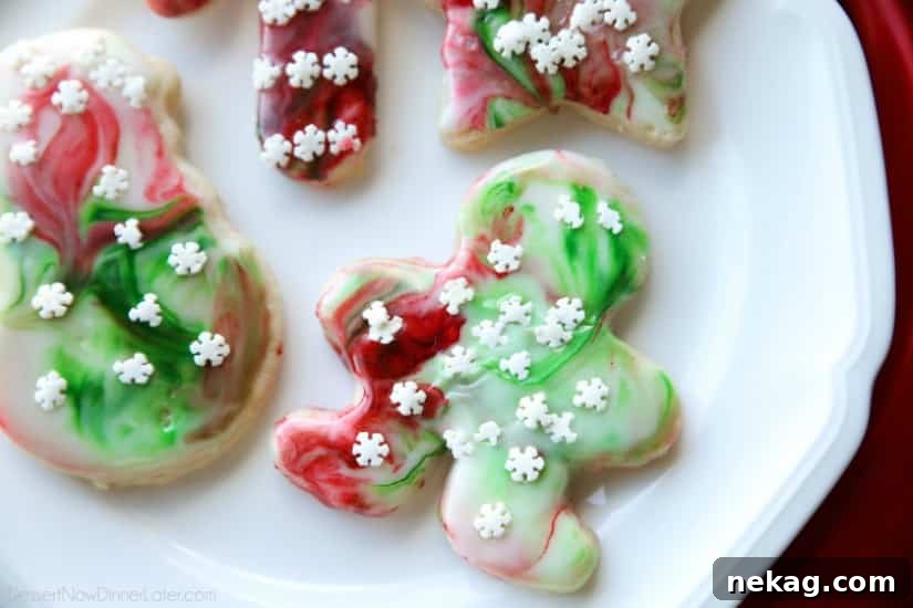 Swirled Christmas Sugar Cookies make cookie decorating easy! Simply swirl food coloring in a special glaze and dip the cookie!