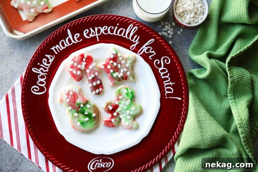Swirled Christmas Sugar Cookies make cookie decorating easy! Simply swirl food coloring in a special glaze and dip the cookie!