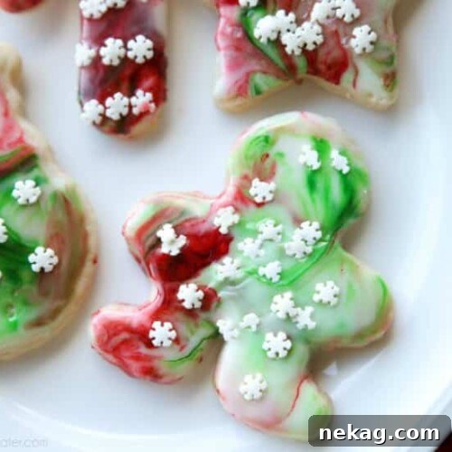 Swirled Christmas Sugar Cookies make cookie decorating easy! Simply swirl food coloring in a special glaze and dip the cookie!