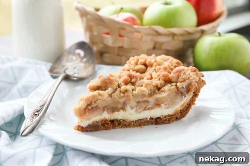Apple Streusel Cheesecake Pie (Recipe + How-To Video) 5 Apple Streusel Cheesecake Pie combines two dessert favorites with a graham cracker crust, creamy cheesecake layer, homemade apple pie filling, and crunchy streusel topping.