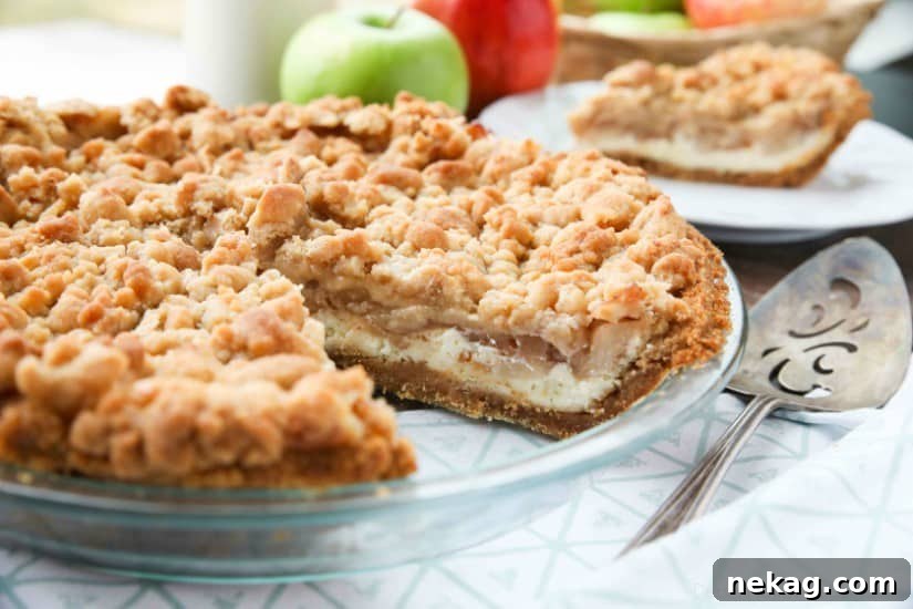 Apple Streusel Cheesecake Pie (Recipe + How-To Video) 6 Apple Streusel Cheesecake Pie combines two dessert favorites with a graham cracker crust, creamy cheesecake layer, homemade apple pie filling, and crunchy streusel topping.