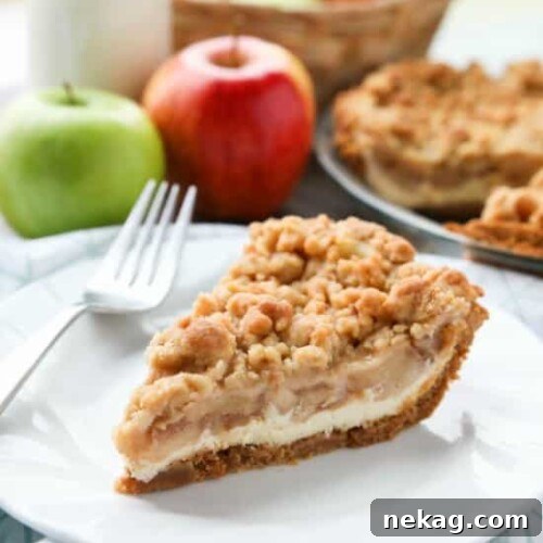 Apple Streusel Cheesecake Pie (Recipe + How-To Video) 7 Apple Streusel Cheesecake Pie combines two dessert favorites with a graham cracker crust, creamy cheesecake layer, homemade apple pie filling, and crunchy streusel topping.