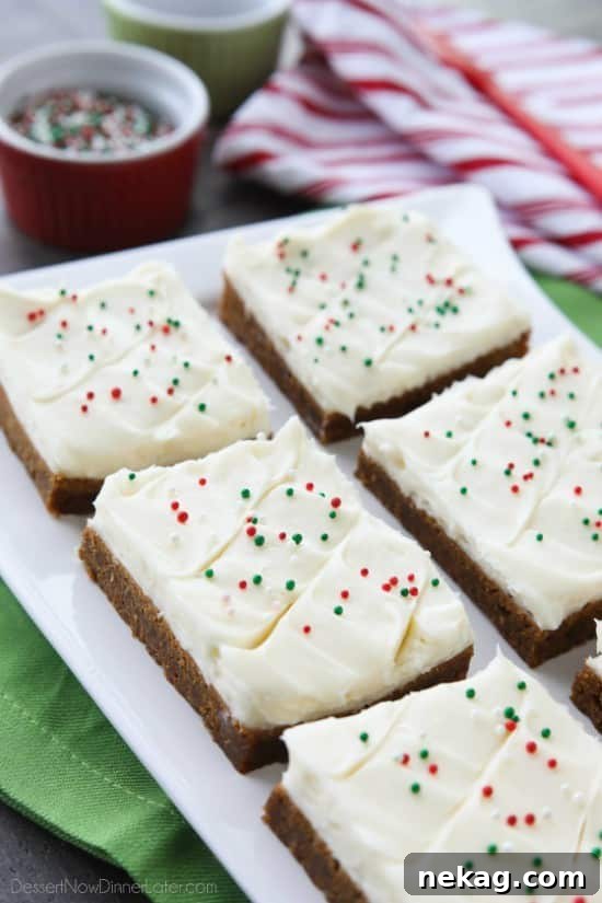 Stacked Gingerbread Cookie Bars topped with festive sprinkles.